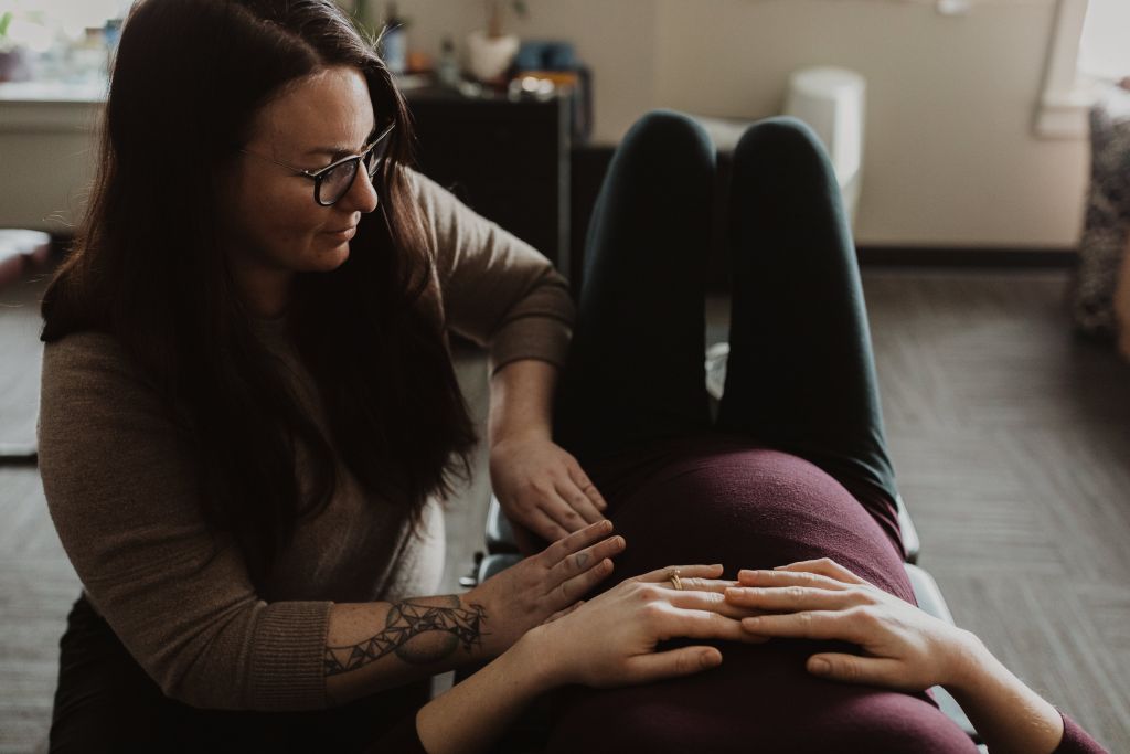 Chiropractor works on a pregnant client