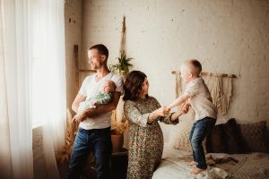 Amber posing with her husband and two kids in a candid photo