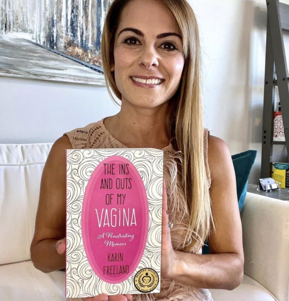 "The Ins and Outs of My Vagina - A Penetrating Memoir" by Karin Freeland - Author holding her book