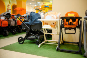 Rows of strollers and highchairs in a store