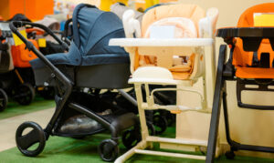 Up close of strollers and highchairs in a store