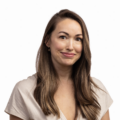 Heidi from Mind Body Baby smiling wearing a beige v-neck against a white background