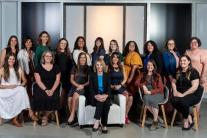 Gold Coast Doulas of Staff Photo with Birth & Postpartum Doulas posing sitting in chairs and standing together