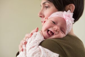 Doula holding baby