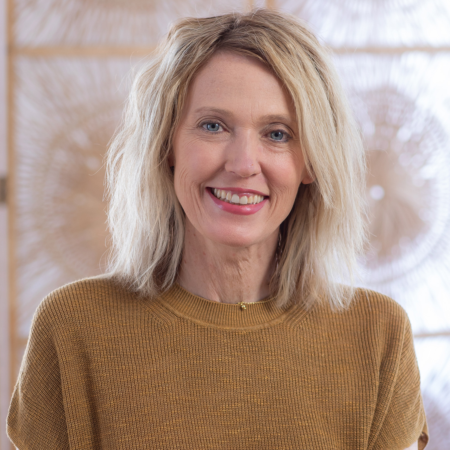 Kristin Revere in tan shirt Headshot Gold Coast Doulas 2022