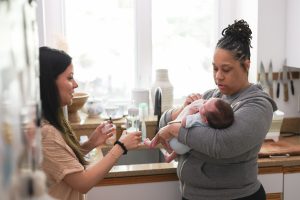 Gold Coast Doulas Holding Baby